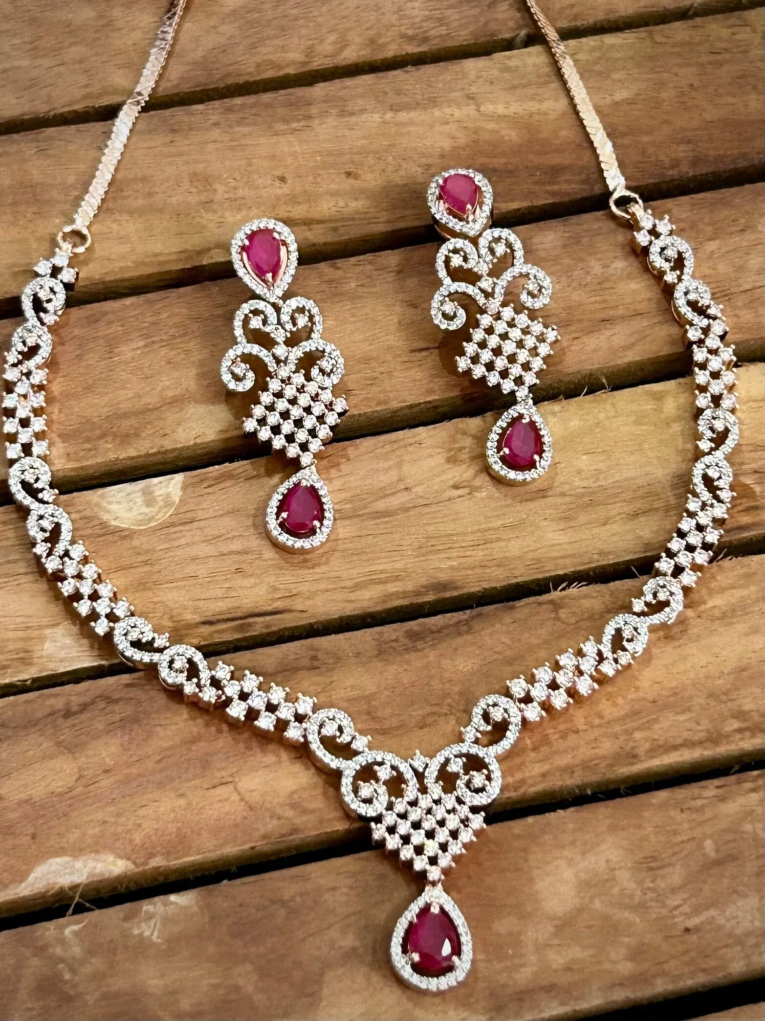 7. Pink American Diamond necklace with pink stones and rose gold polish