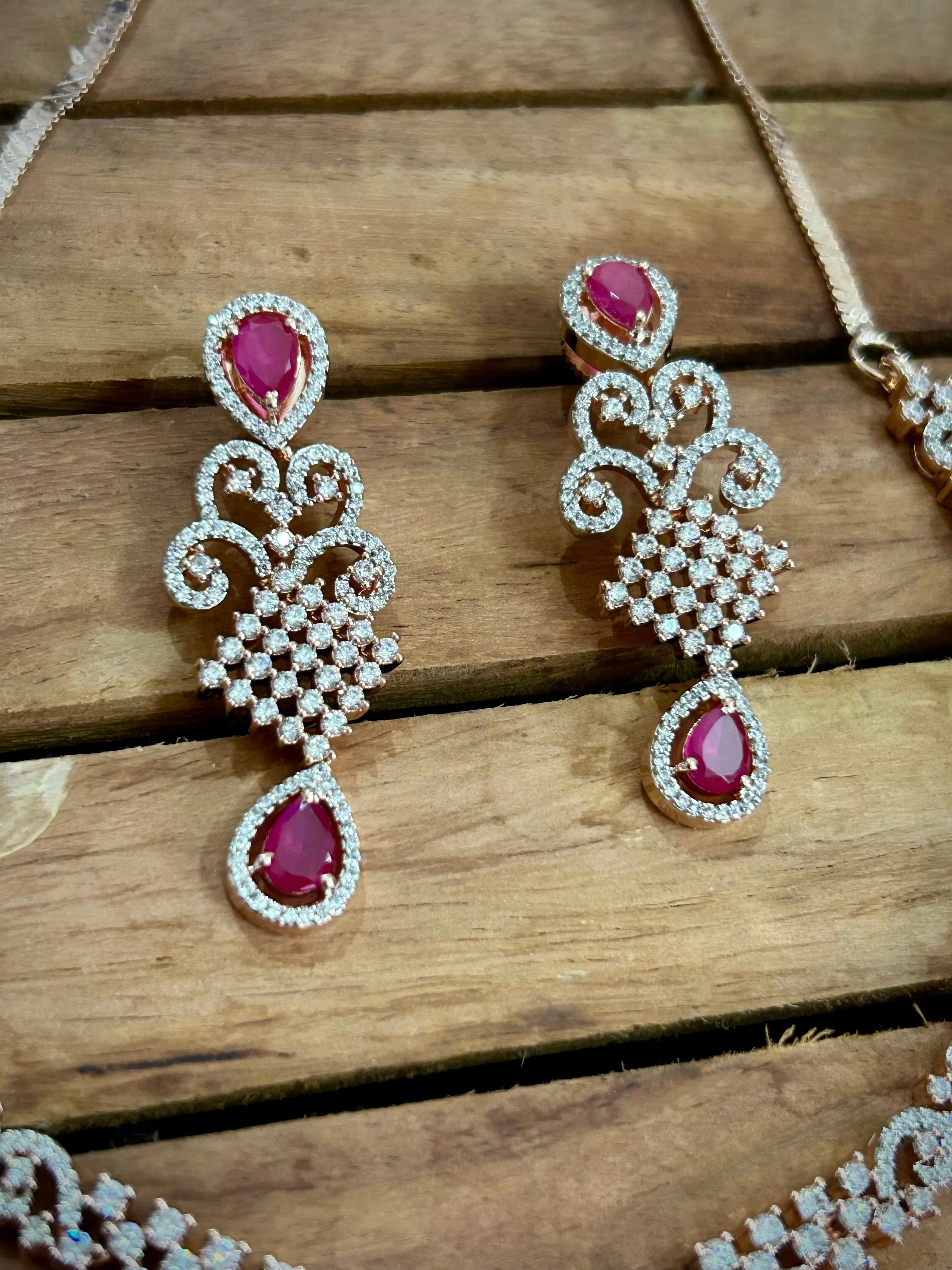 7. Pink American Diamond necklace with pink stones and rose gold polish