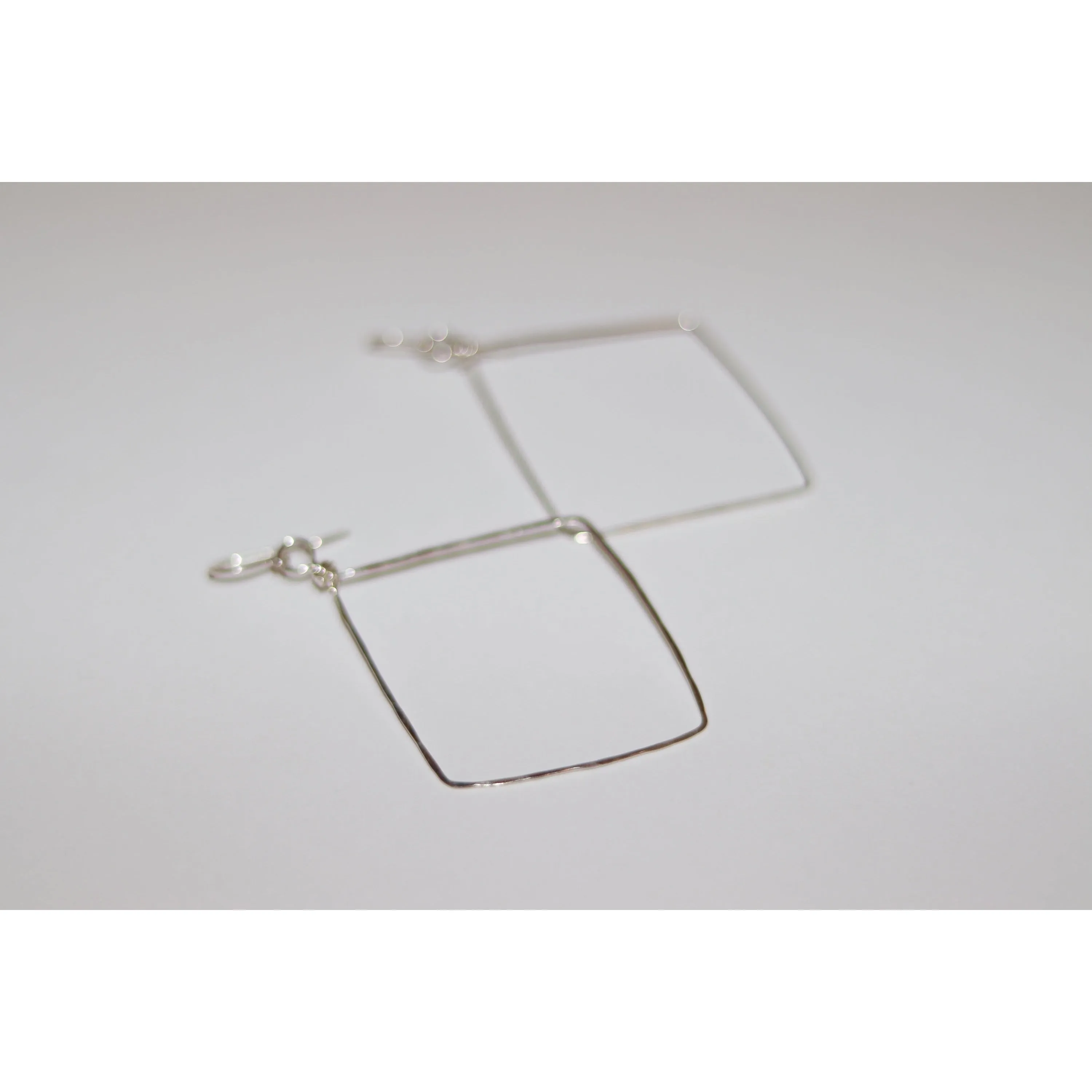 Small Hammered Diamond Shaped Earrings in sterling silver