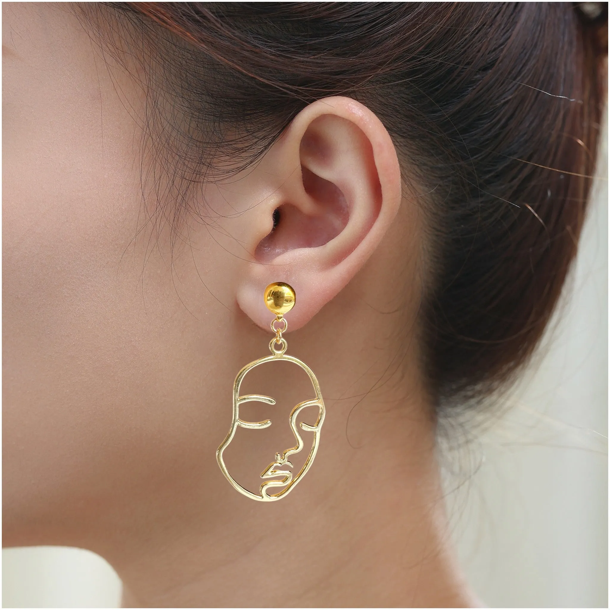 Ti-Go Golden face earrings